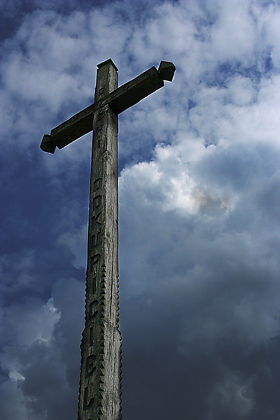 A cross upon her bedroom wall...