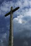 A cross upon her bedroom wall...