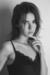 T.