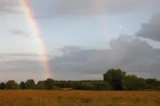 Krajobraz z księżycem i tęczą
