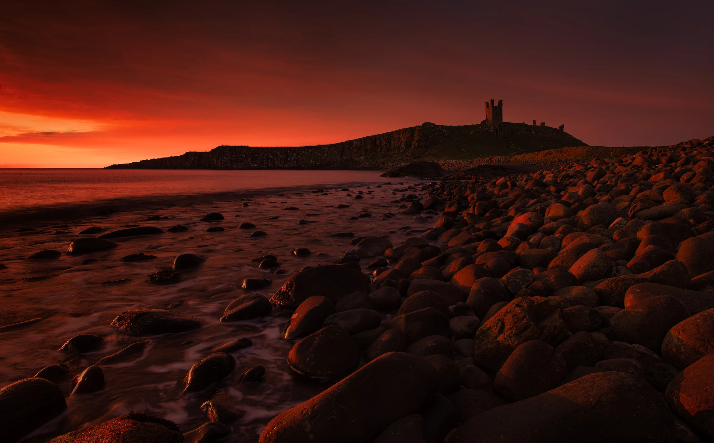 Dunstanburgh on fire